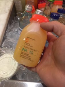 small bottle of orange juice